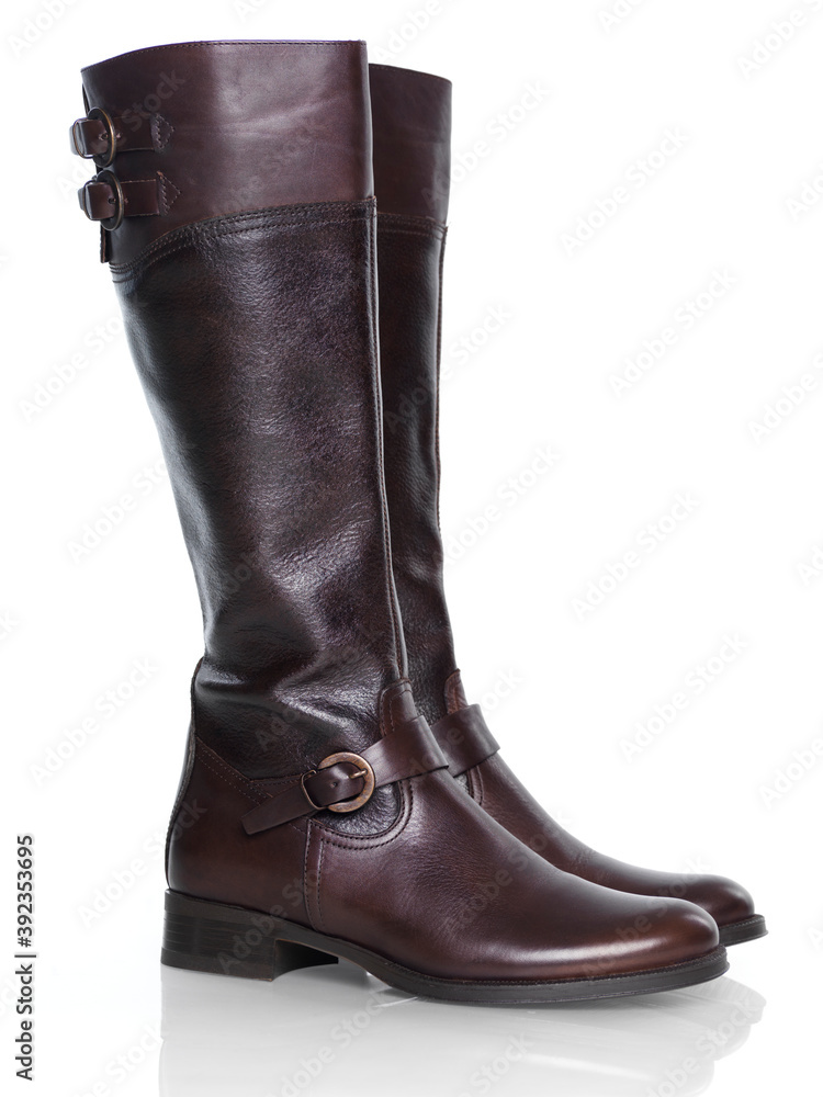 Knee-high brown leather fashion womens boots isolated on white background