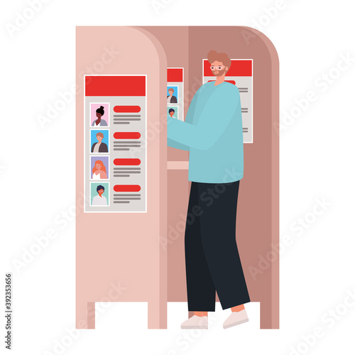 man voting with ligth brown hair and blue coat in voting booth