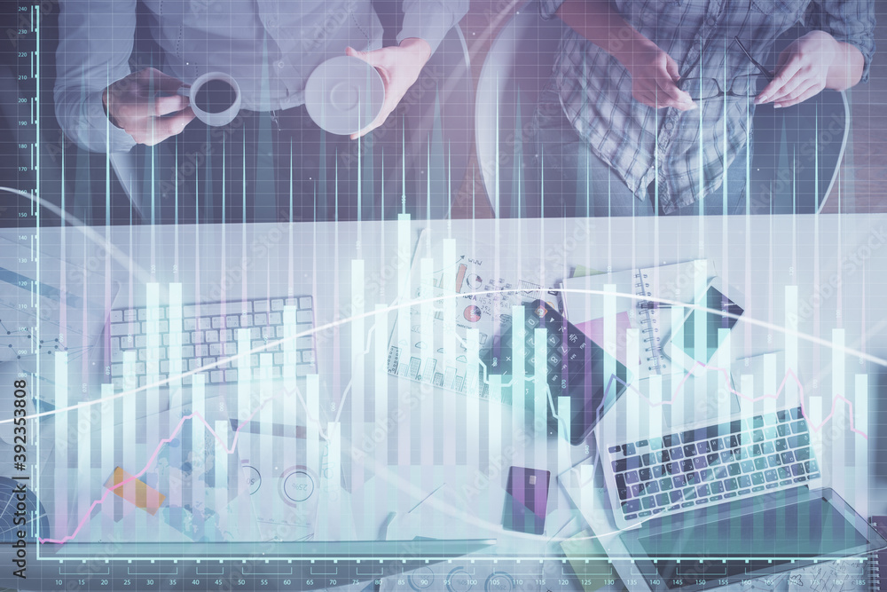 Double exposure of man and woman working together and financial chart hologram drawing. market analysis concept. Computer background. Top View. Double exposure of man and woman working together and financial chart hologram drawing. market analysis concept. Computer background. Top View.