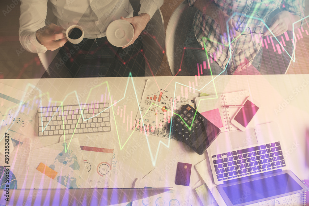Double exposure of man and woman working together and financial chart hologram drawing. market analysis concept. Computer background. Top View. Double exposure of man and woman working together and financial chart hologram drawing. market analysis concept. Computer background. Top View.