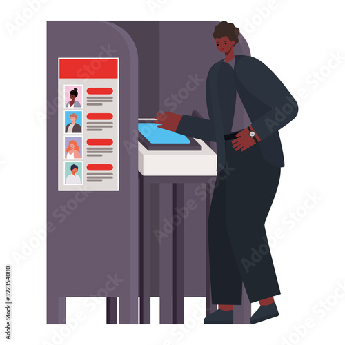 man voting with black hair and black suit in gray voting booth