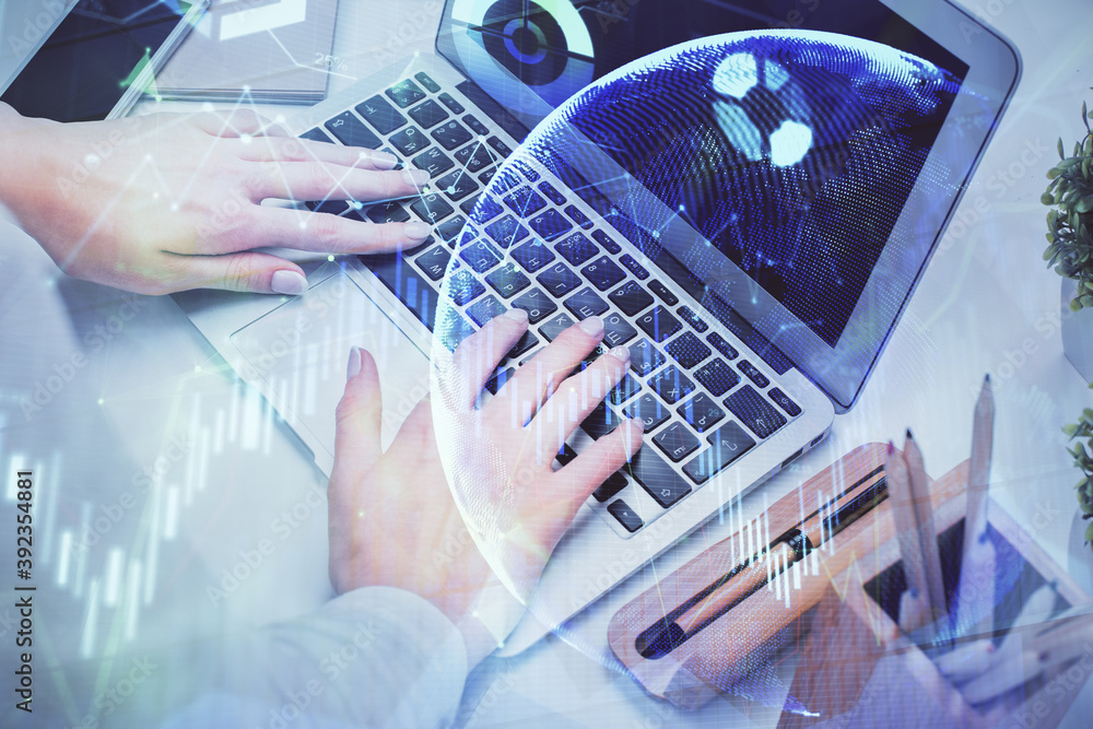 Double exposure of woman hands typing on computer and forex chart hologram drawing. Stock market analysis concept. Double exposure of woman hands typing on computer and forex chart hologram drawing. Stock market analysis concept.