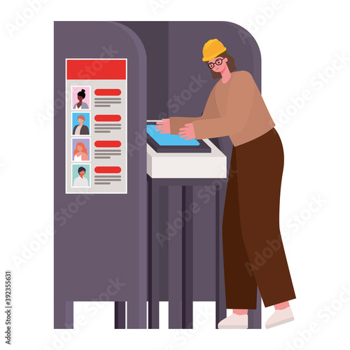 woman voting with brown hair and safety helmet in gray voting booth