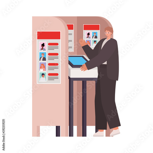 man with ligth brown hair and a dark suit in voting booth