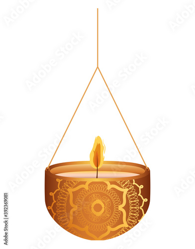 candle of orange color on a chandelier on a white background