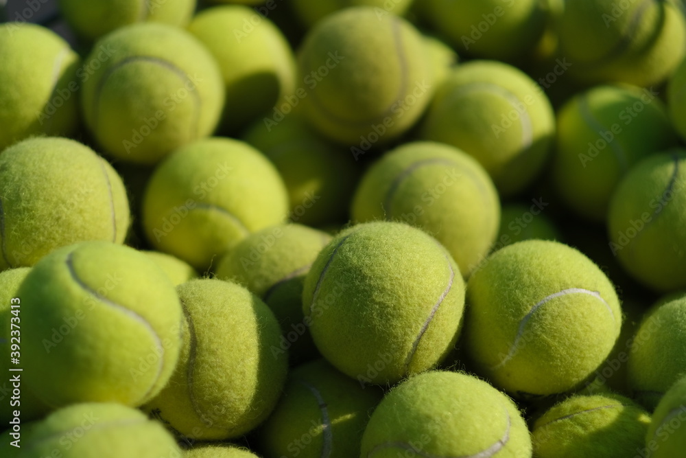close up many tennis balls heap under sunlight close up many tennis balls heap under sunlight