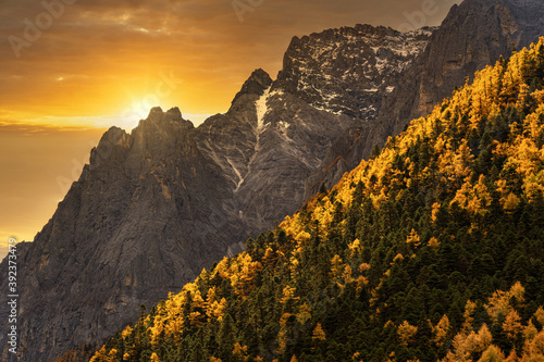 Scene of sunset at The mountain in autumn season in yading nature reserve, Daocheng County, southwest of Sichuan Province, China.travel destination and tourism,famous place and landmark concept. photo