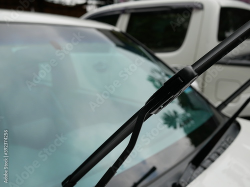 closeup of car windshield wiper and raised up.