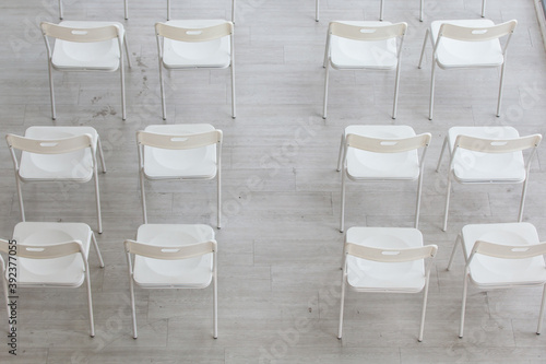 Top view  Browse chairs in the departure lounge. rows of wooden chairs with white 
