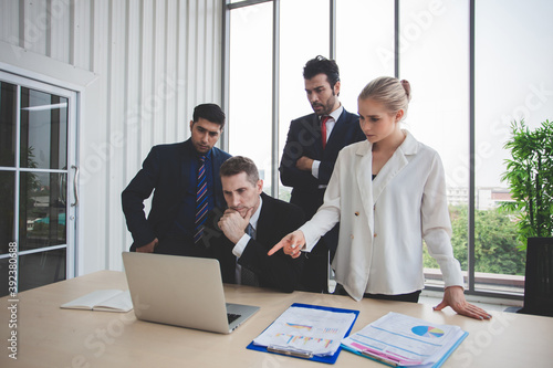 young businessmen using touchpad at meeting. Businesspeople discussing together in conference room during meeting at office