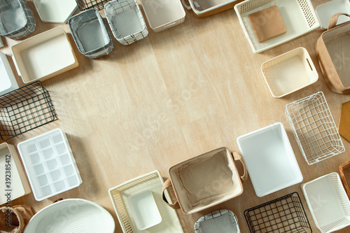 Top view of closet organization boxes and steel wire baskets in different shapes. photo