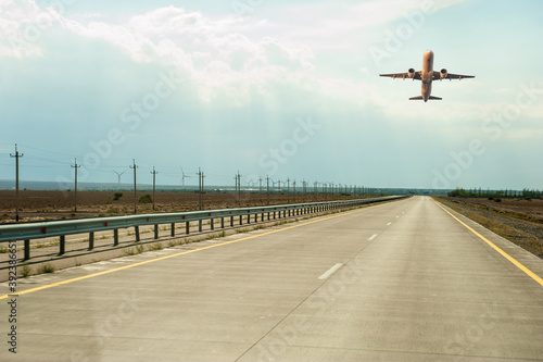 Takeoff of the passenger airplane and the runway outdoors
