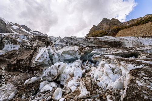 Alibek glacier. Autumn in Caucasus mountain. Eco tourism and hiking in mountain, travel destination.