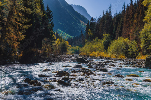 Fototapeta Naklejka Na Ścianę i Meble -  Canyon of mountain river with blue water. Autumn in Caucasus mountain. Hiking and eco tourism in mountain.