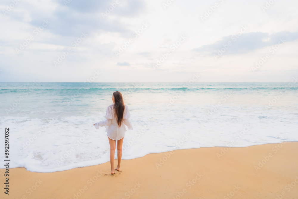 Portrait beautiful young asian woman relax leisure around outdoor beach sea ocean