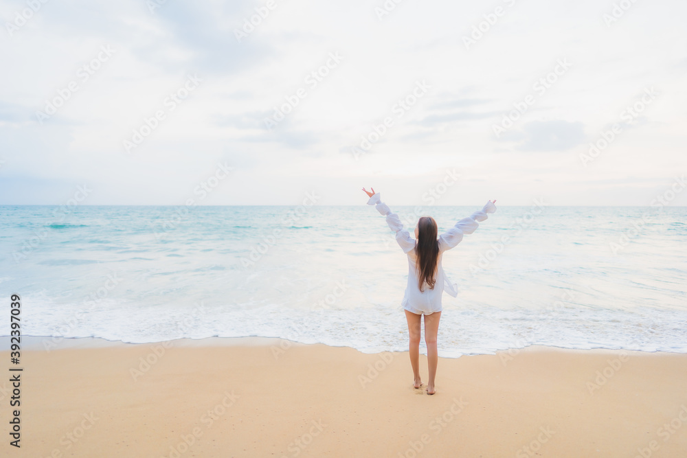Portrait beautiful young asian woman relax leisure around outdoor beach sea ocean