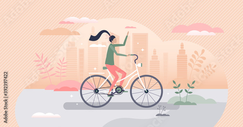 Girl riding bike as urban cycling transportation scene tiny person concept