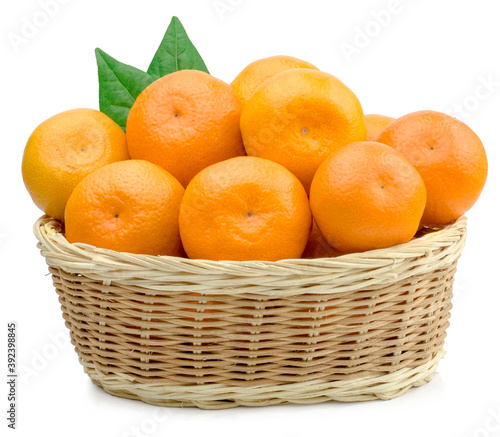Fresh tangerines in a basket isolated on white