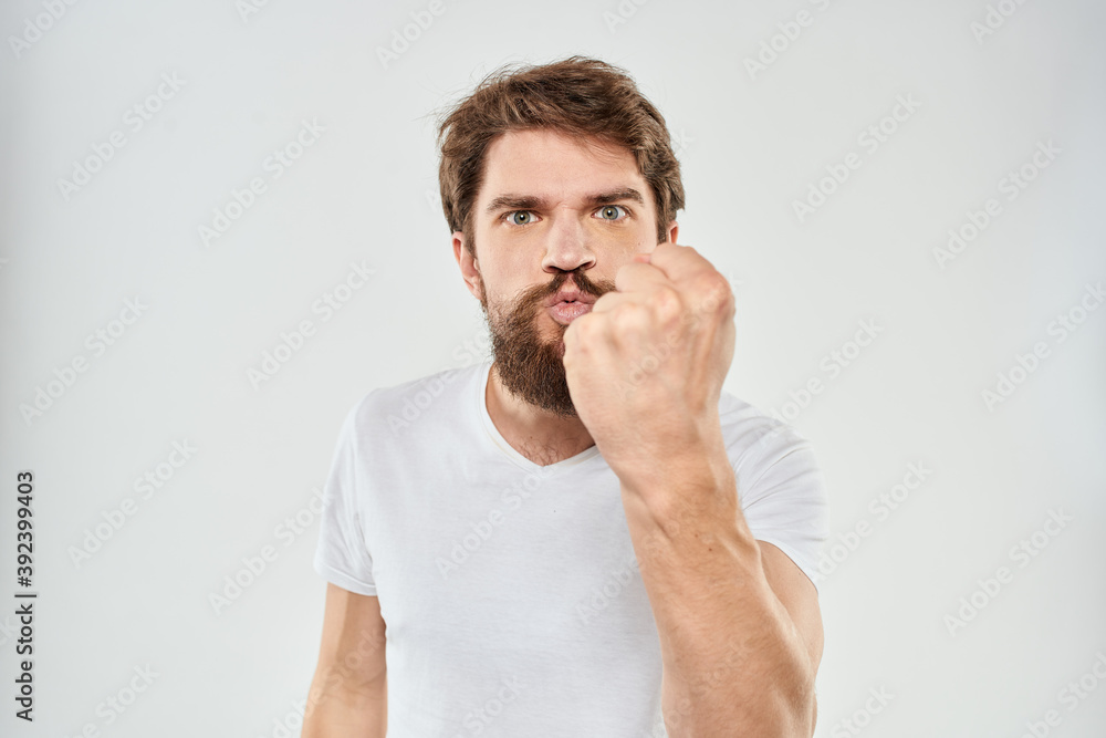 emotional man with a beard gesturing with his hands close-up studio aggression emotional man with a beard gesturing with his hands close-up studio aggression
