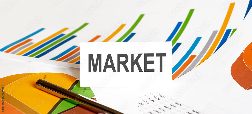 MARKET text on paper on chart background with pen MARKET text on paper on chart background with pen