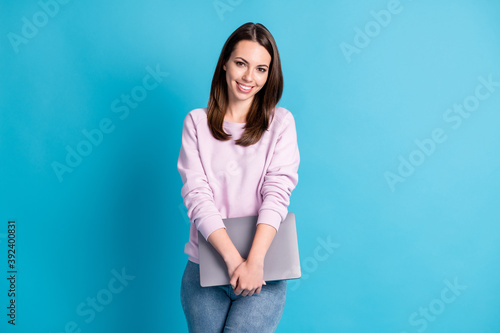 Photo of attractive toothy business lady office worker hold notebook hands conference meeting lecture staff education wear casual purple sweatshirt jeans isolated blue color background