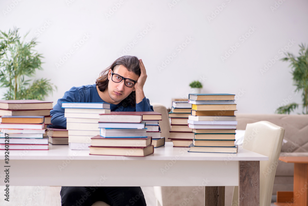 Young male student preparing for exams at home Young male student preparing for exams at home