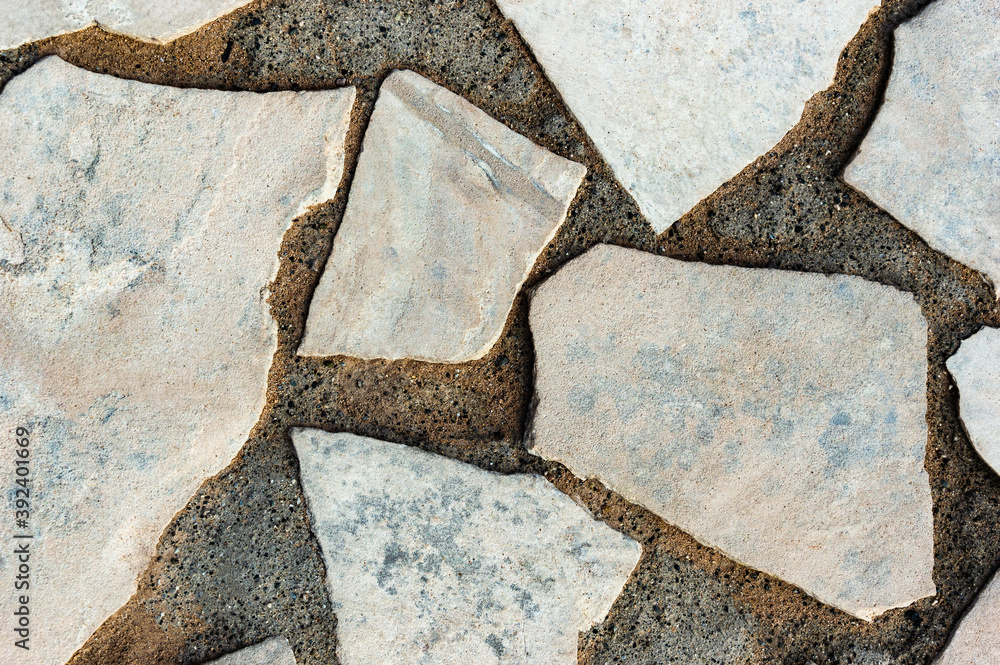 Fototapeta premium Cracked Concrete Texture Cobblestone Closeup