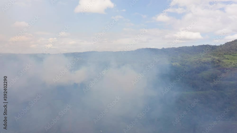 Forest fire in the mountains. Using fire to destroy natural habitat and causing large scale environmental damage in Asia. Mindanao, Philippines Forest fire in the mountains. Using fire to destroy natural habitat and causing large scale environmental damage in Asia. Mindanao, Philippines