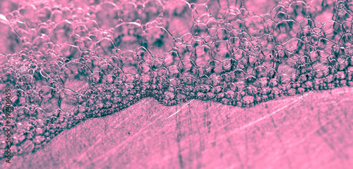 Pink foam in the sink as an background.