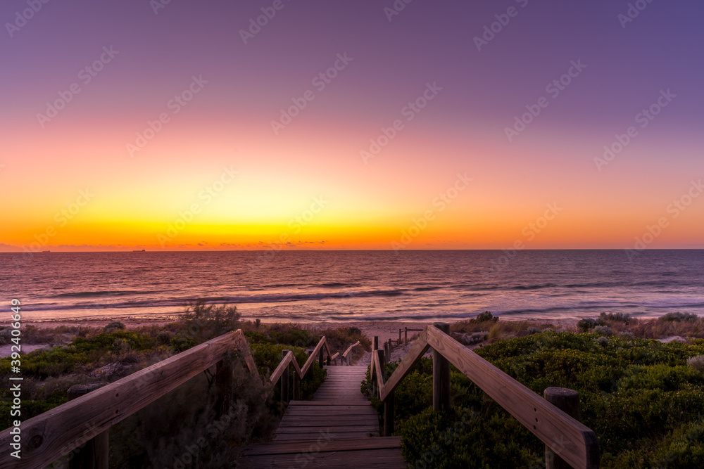 Beautiful sunset  and dawn at seaside with staircase to the sea