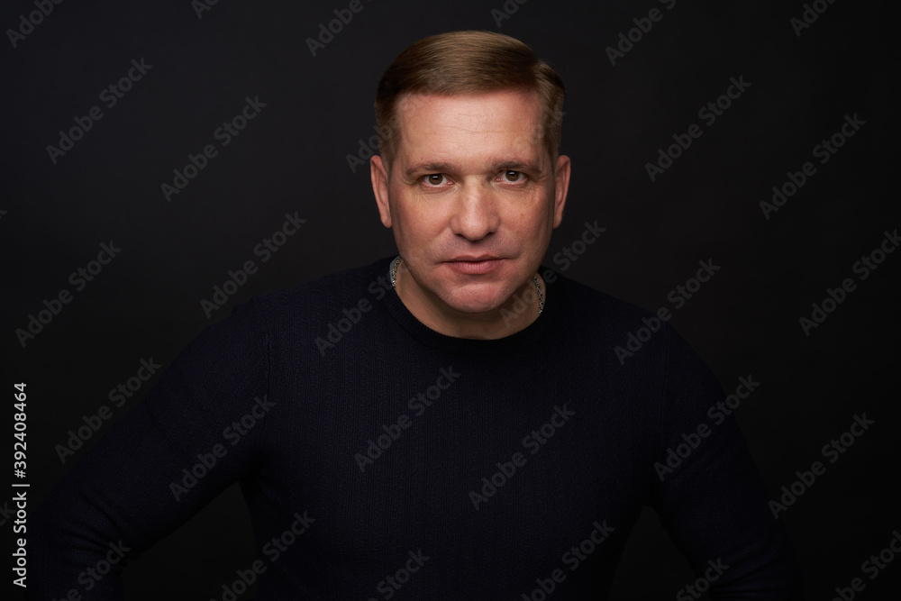 Studio portrait of a 40 years old caucasian man