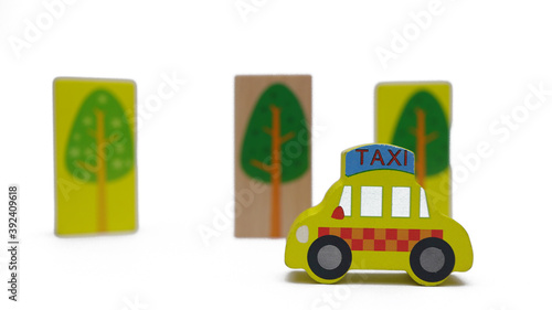Yellow taxy toy in isolated white background