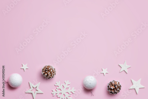 Christmas decoration on pastel pink surface. Top view, flat lay composition with copy space. Christmas background
