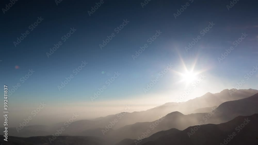 Time lapse of hazy sunset, Tizi n test Pass, Atlas mountains, Morocco Time lapse of hazy sunset, Tizi n test Pass, Atlas mountains, Morocco
