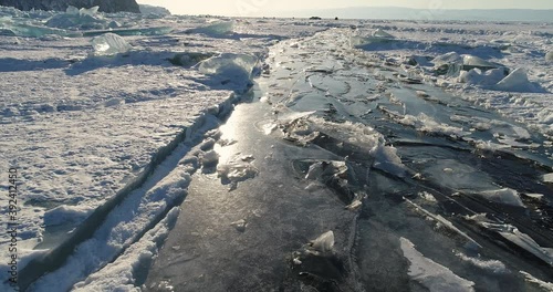 Lake Baikal in winter. The abstract and dense lines of ice. A popular travel destination in Russia. Aerial view of the ice.