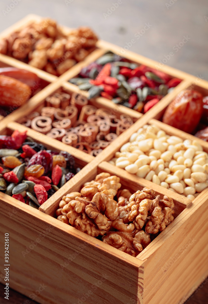 Dried fruits, various nuts and seeds in wooden box. Dried fruits, various nuts and seeds in wooden box.