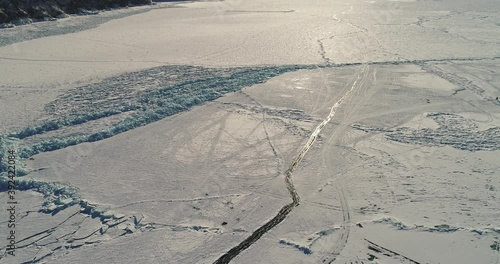 Lake Baikal in winter. The abstract and dense lines of ice. A popular travel destination in Russia. Aerial view of the ice.