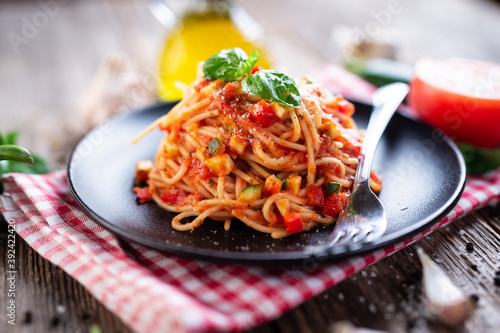 Spaghetti with eggplant, zucchini, paprika and tomato sauce