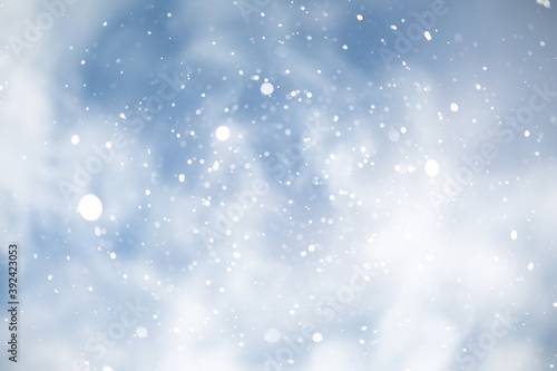 blue snowfall bokeh background  abstract snowflake background on blurred abstract blue
