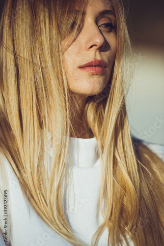 Sunny portrait of young beautiful woman