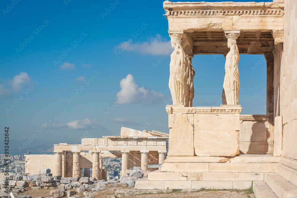View in the Acropolis on the Porch of the Caryatids of Erechthion against the background of blue sky