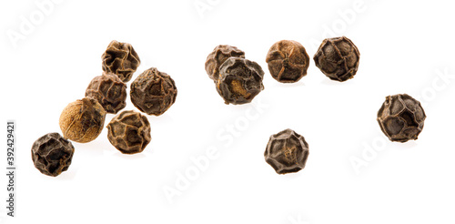 Ground black pepper isolated on a white background top view