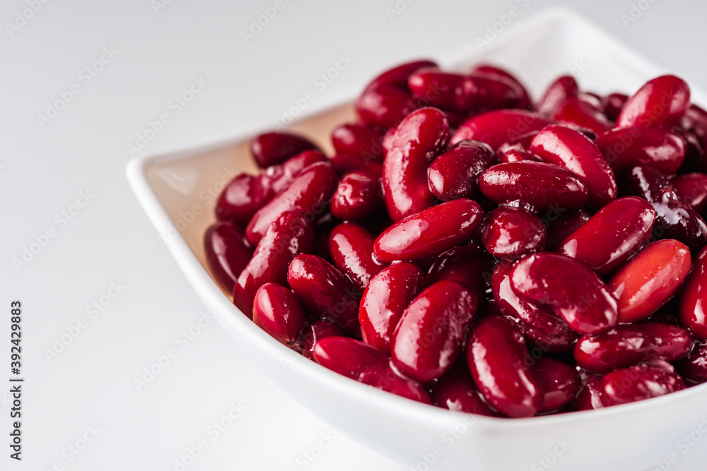 canned red kidney beans on a white acrylic background canned red kidney beans on a white acrylic background