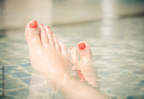 Wallpaper Mural Beautiful female feet relaxing by the swimming pool Torontodigital.ca
