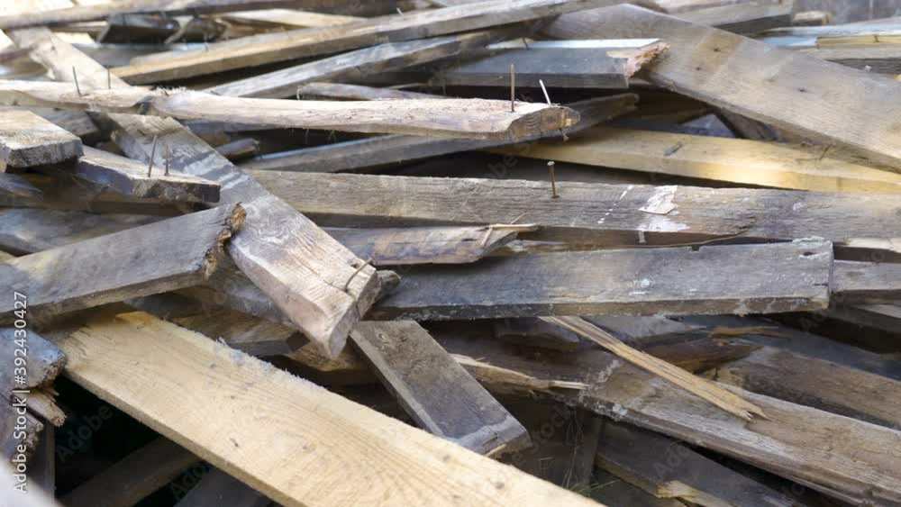 The look of the pieces of woods on the ground with the nails still on it The look of the pieces of woods on the ground with the nails still on it