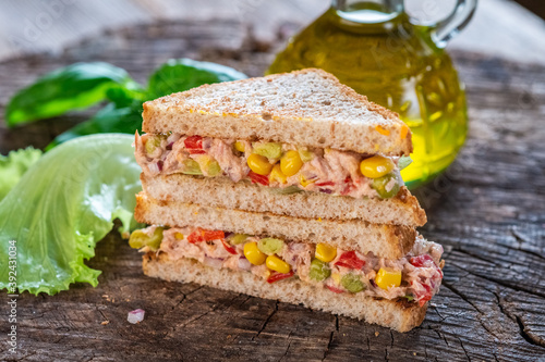 Healthy tuna sandwich with tomato, corn and onion 