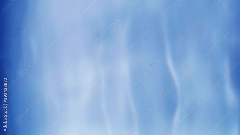 Slow motion the top view of drop falling into the water surface and diverging circles on white background Slow motion the top view of drop falling into the water surface and diverging circles on white background