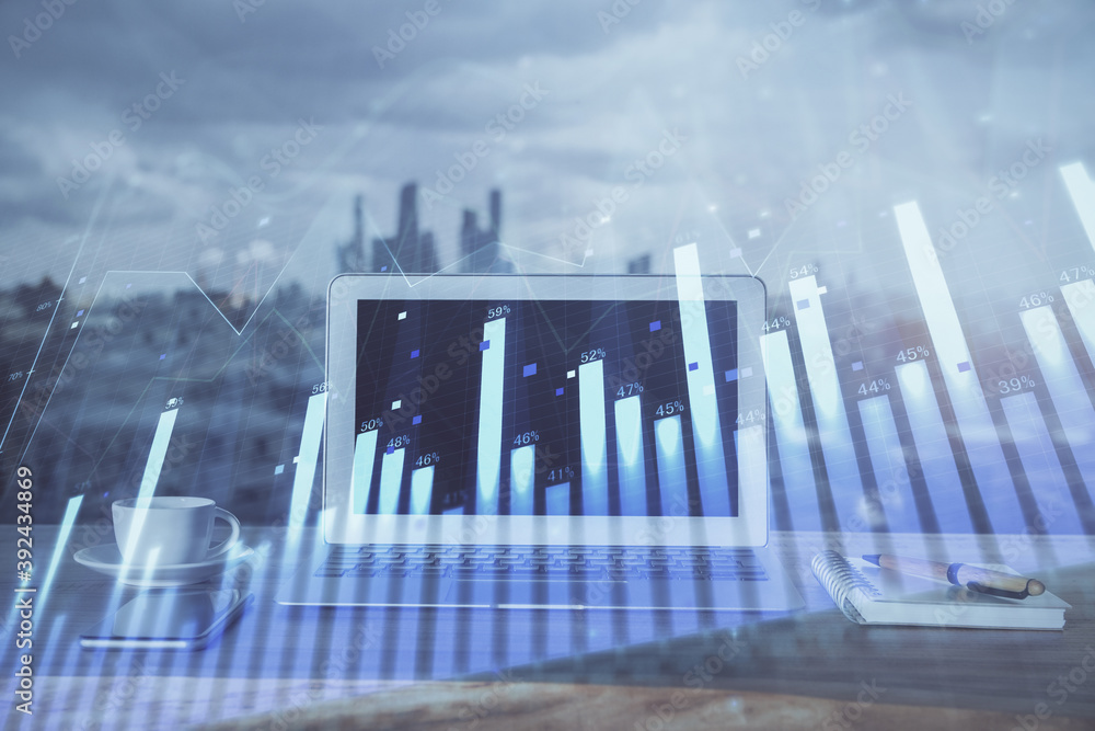 Fototapeta premium Forex Chart hologram on table with computer background. Multi exposure. Concept of financial markets.