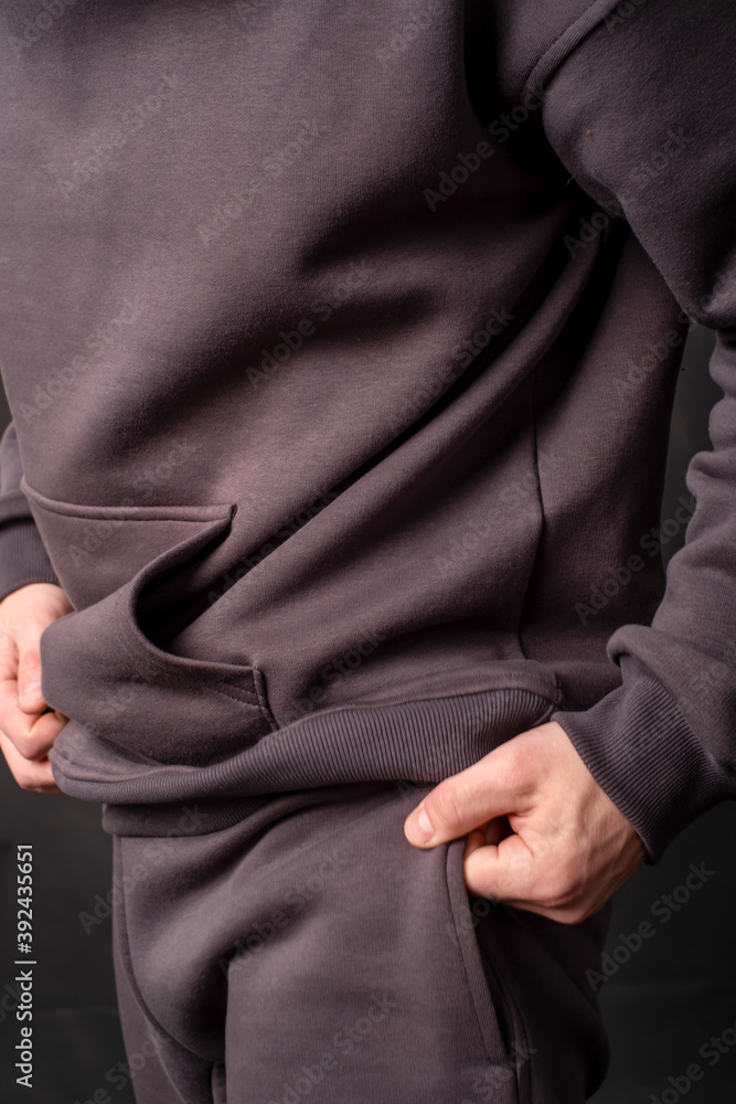 parts of hoodie clothing on men on a colored background