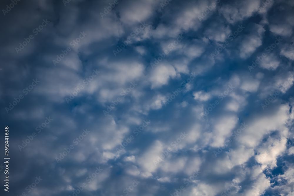 Blue sky with fluffy clouds, abstract natural background texture